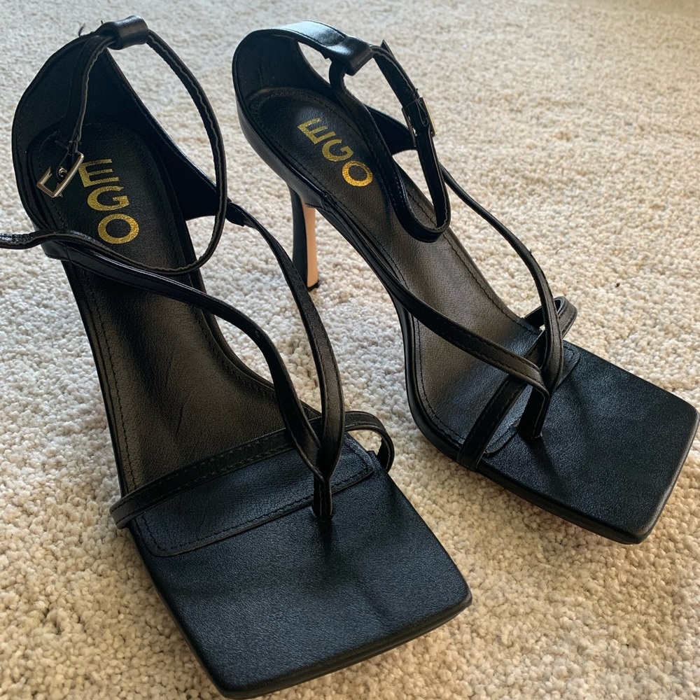 Ego brand black strappy square toe heels.